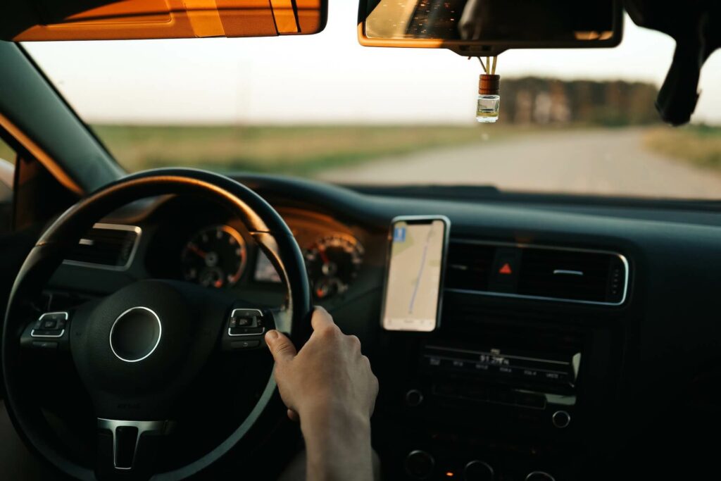 A driver with a map on a smartphone