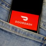 Phone in jeans with an open DoorDash app