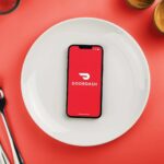 Smartphone on a plate with an open DoorDash app
