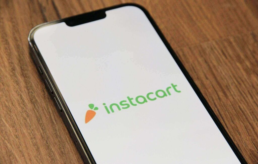 A smartphone displaying the Instacart logo