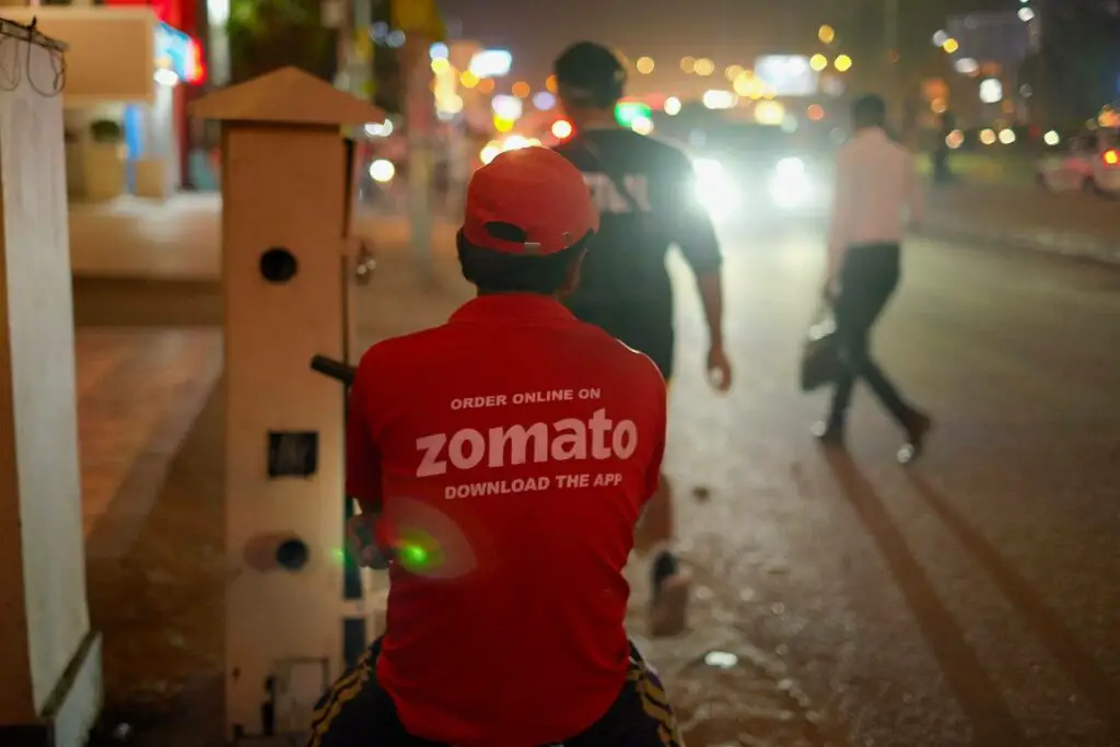 Zomato delivery man sitting on a bicycle