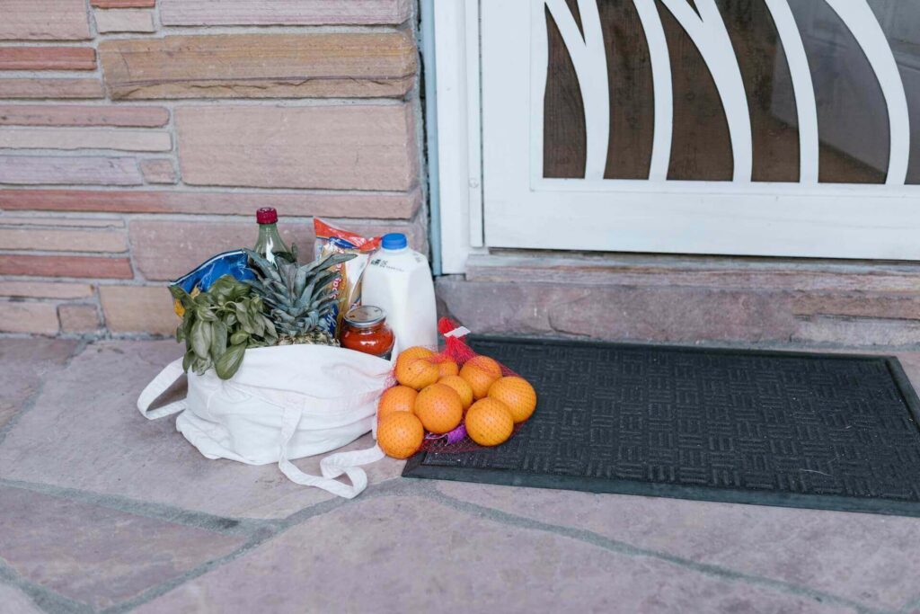 A bag with groceries on the floor